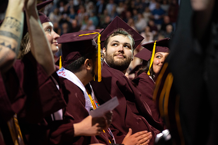 A group of people in graduation gowns and caps