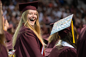 A woman in a graduation gown