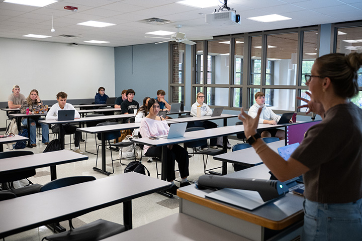 A group of people sitting in a classroom