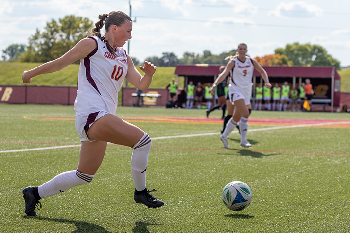 A group of women playing soccer.