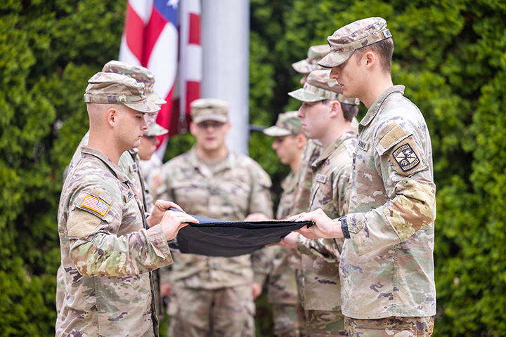A group of soldiers holding a flag