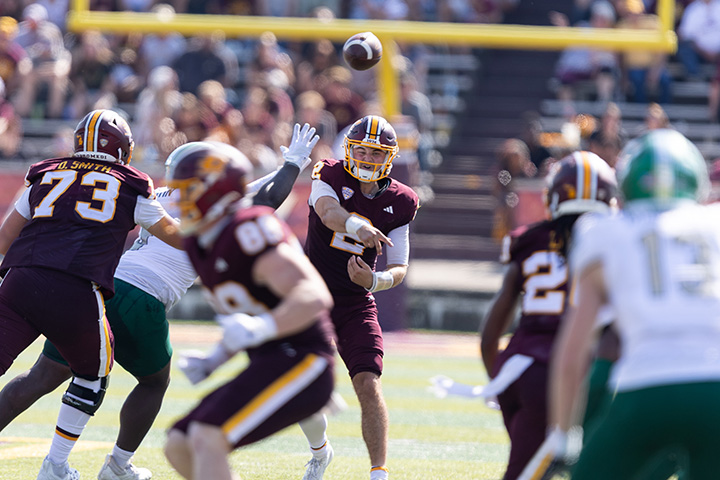 A football player throwing a football