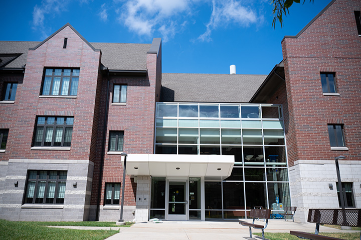 A large brick building with glass windows.