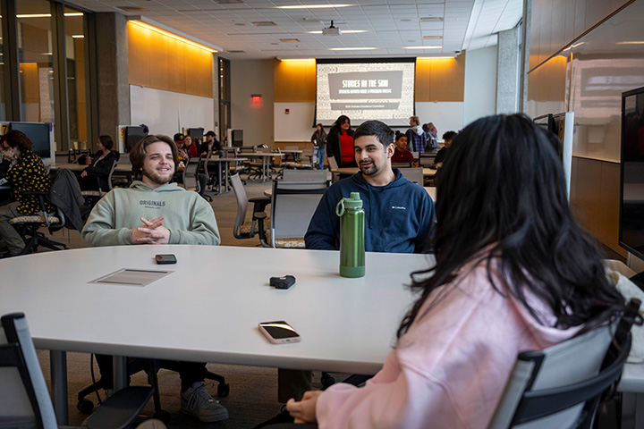 A group of students sitting at a table.
