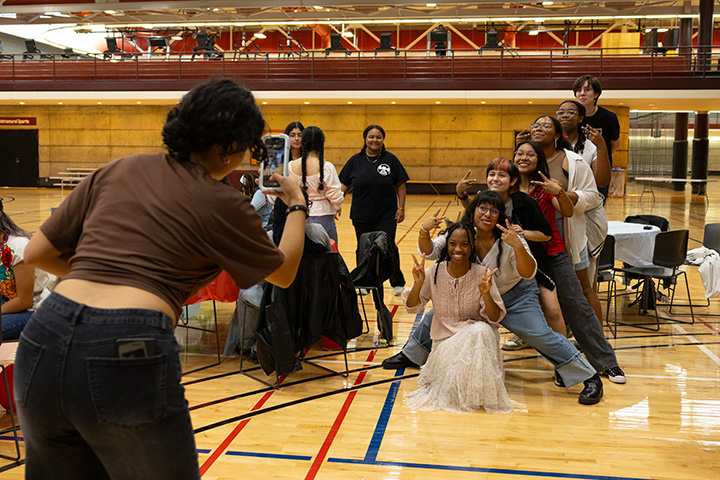 A group of students pose for a photo inside the Student Activity Center