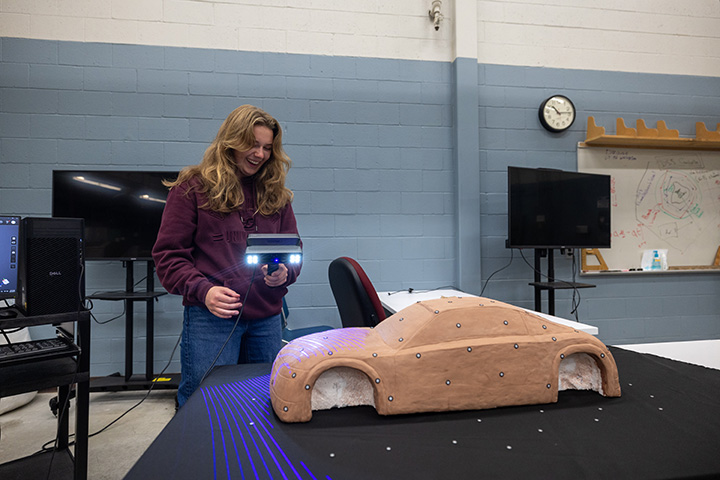 A student scans a model car she built