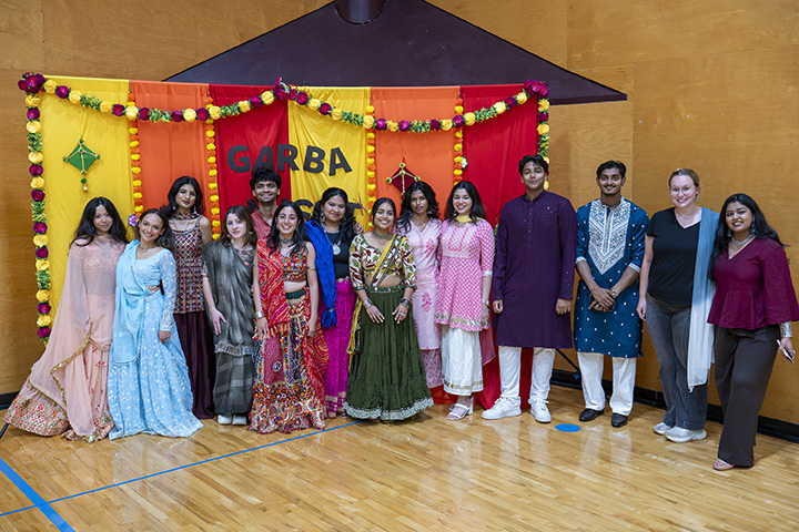 Students from the RSO Chamakta Central pose for a group photo while wearing colorful attire
