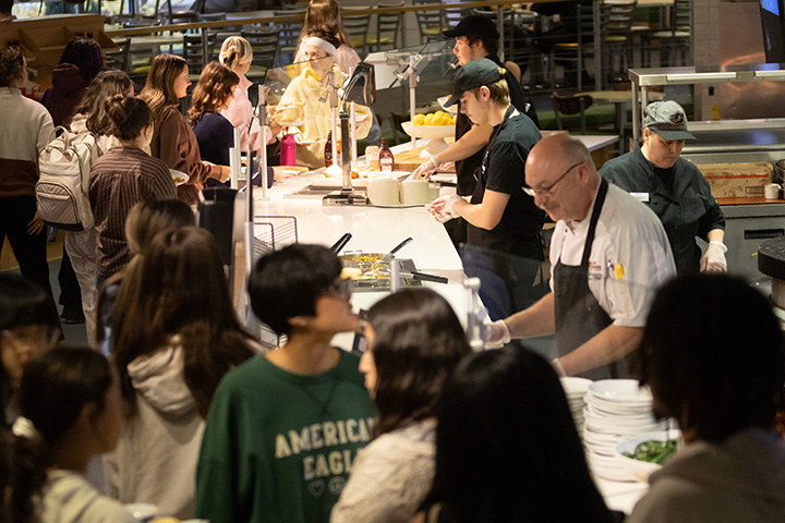 A large group of students get food inside a CMU Dining hall