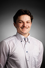 A studio headshot of Jacob Dengate