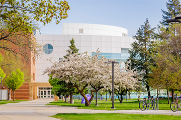 a building with trees and grass.