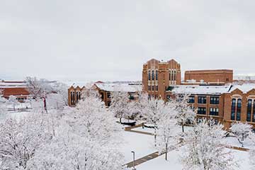 A drone image of Warriner Hall in the snow
