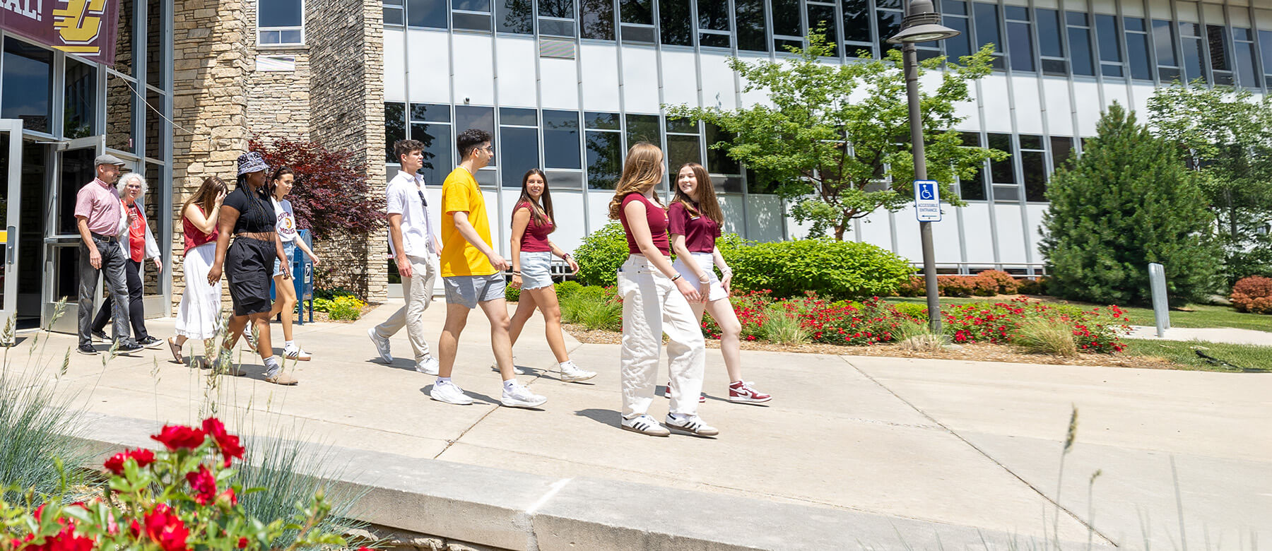 Parents and students getting a tour around campus of Central Michigan University