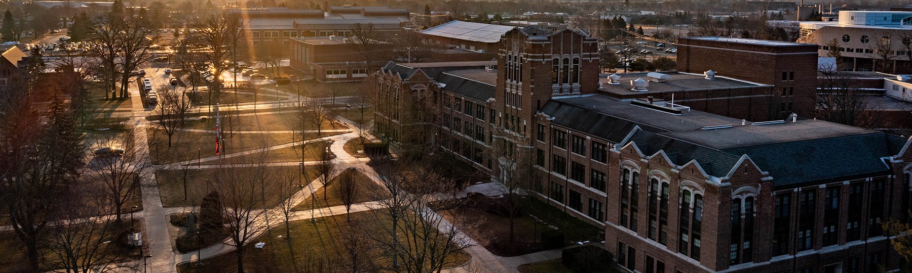 The sun shining down on Warriner Hall and Warriner Mall on Central Michigan Universitys campus.