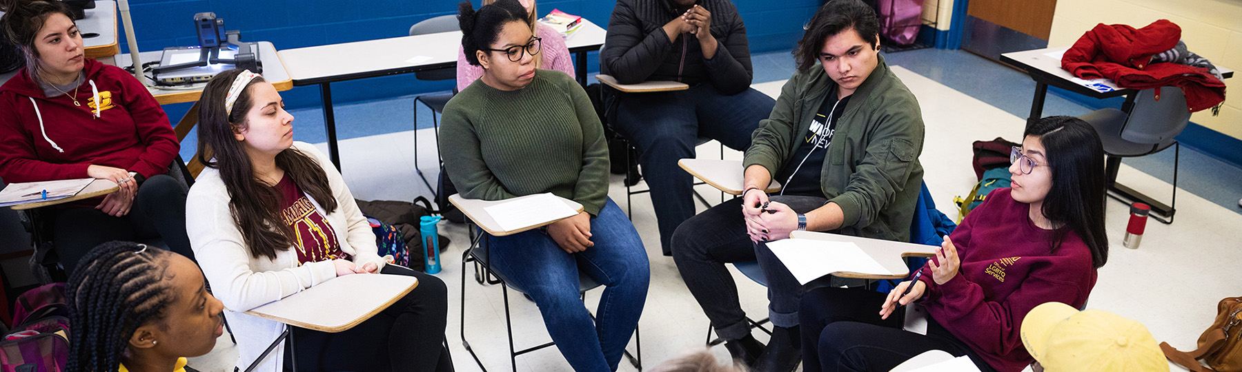 Students sitting in circle talking