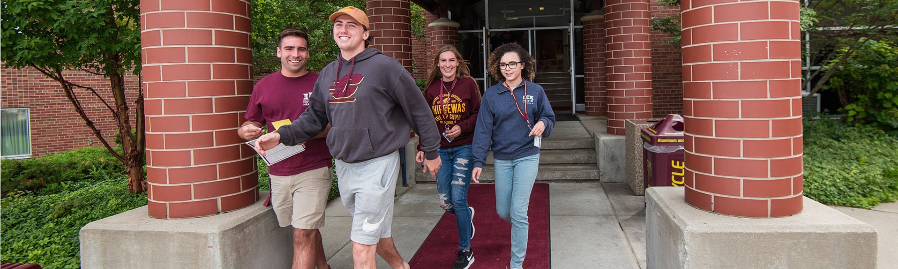 Students walking outside entrance of East Community