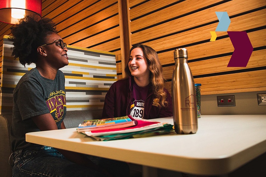 Students at a table in discussion