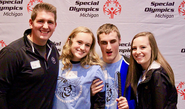 A group of CMU students and Special Olympics athletes pose for a photo at the Leadership Launch