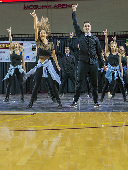Students perform during Greek Life event