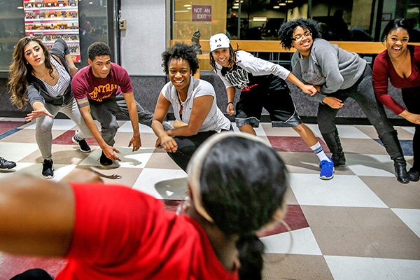 7 students participating in a stretching exercise.