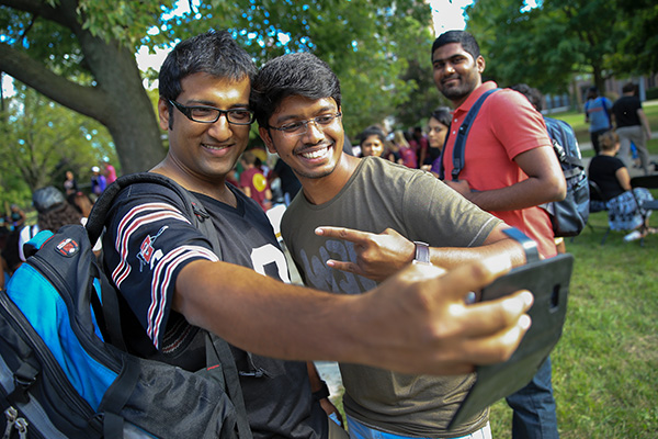 Two international students take a selfie during Get Acquainted Day