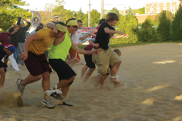 Students participating in a three-legged race