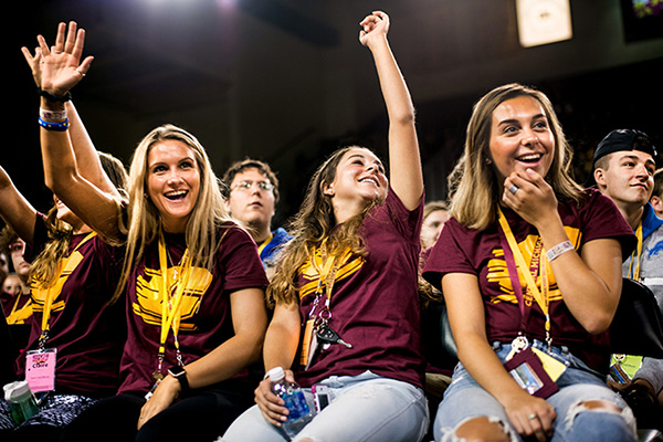 A group of smiling students wearing maroon and gold t-shirts in the crow at the annual Leadership Safari event