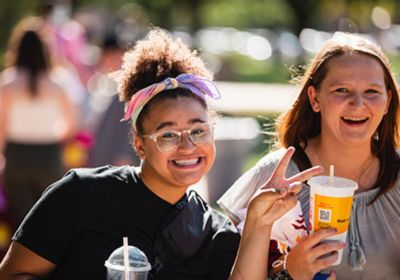 Two CMU students pose for a picture at MainStage