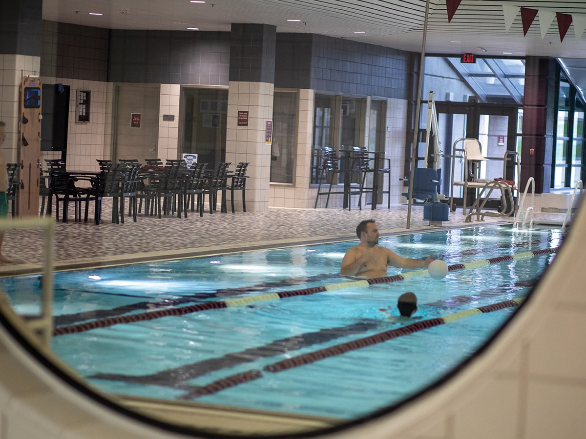 Father and son swimming in the SAC pool