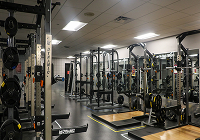 A room filled with weight training equipment.