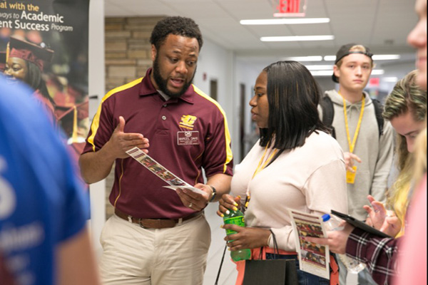 An advisor talking to a student