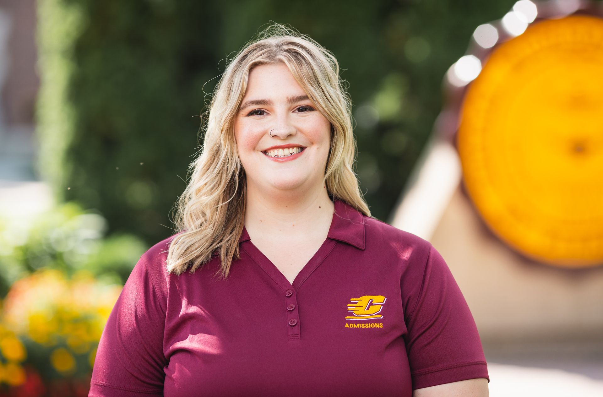 Sarah Haggerty wearing a Central Michigan University Admissions T-shirt while looking at the camera.