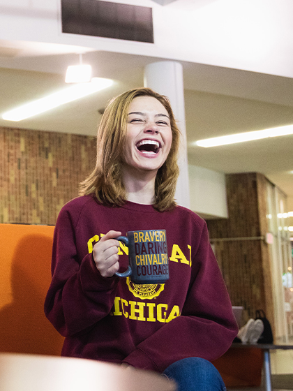student enjoying a cup of coffee