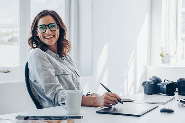 person at desk with laptop