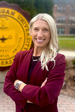 Lizzie VanDorin standing outside of the seal in Warriner Mall.
