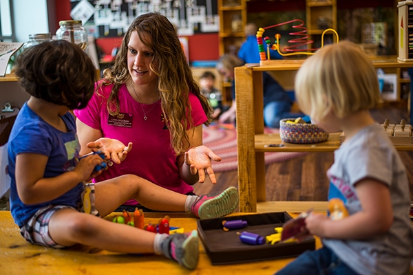 Student working with children.