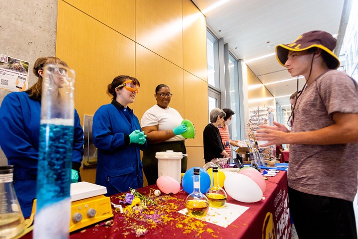 Prospective student discussing a science demonstration.