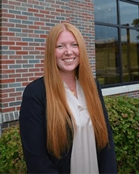 Aubrey George wearing a black blazer with white shirt