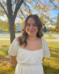 Olivia a woman in a white dress