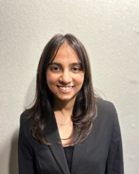 Pratichee a woman in a black suit