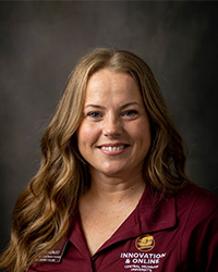 Cheryl Gonzalez wears CMU polo while posing for a headshot.