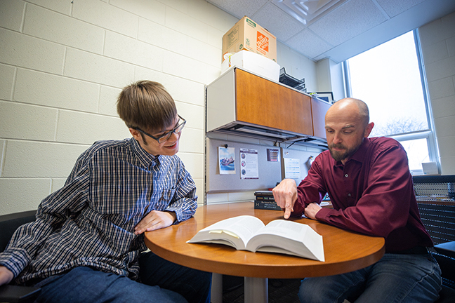 Devere Edwards and Dr. Joshua Smith research Defining Knowledge during the McNair Research Institute 2025.