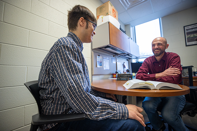 Devere Edwards and Dr. Joshua Smith research Defining Knowledge during the McNair Research Institute 2025.