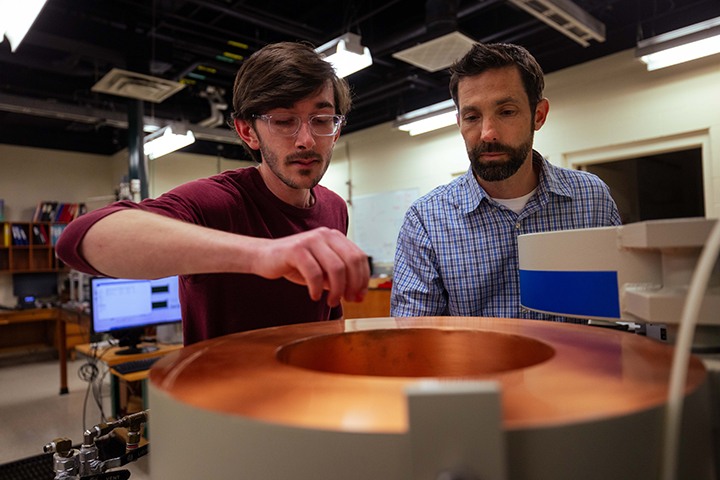 Ryan Opperman and Matthew Redshaw Ryan Opperman and Dr. Matt Redshaw research Using FT-ICR for a Neutron Lifetime Beam Measurement during the McNair Research Institute 2026.