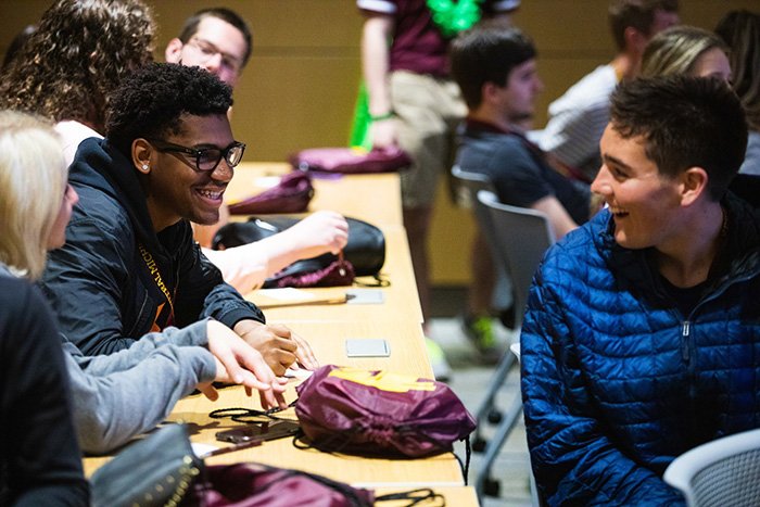 Two students talking with each other at New Student Orientation