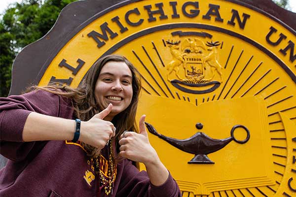 Student giving a thumps up