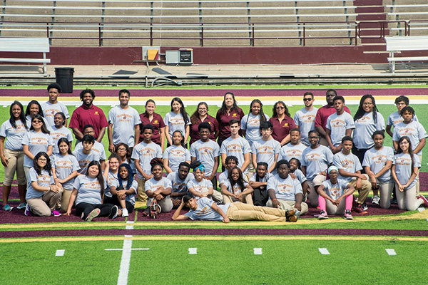 Group picture of TRIO participants taken on the CMU football field