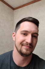 Headshot photo of SI leader Travis Miiller.