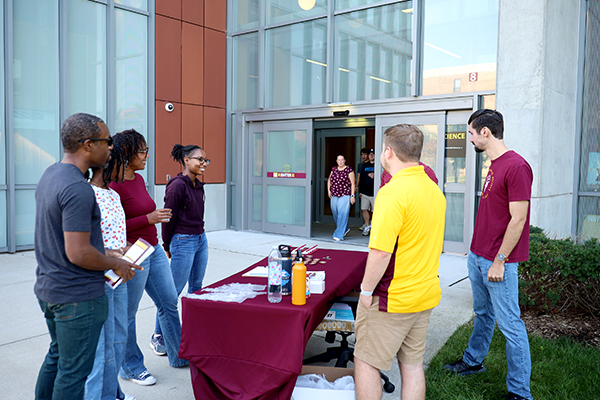 High school students and supporters take part in an activity at the Biosciences Building during Discover CMU.