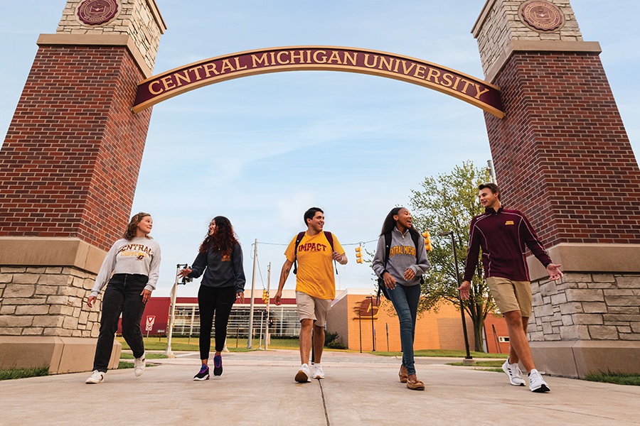 CMU Students under CMU Sign Arch