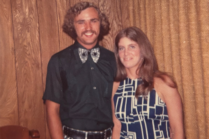 A man and woman posing for a picture.